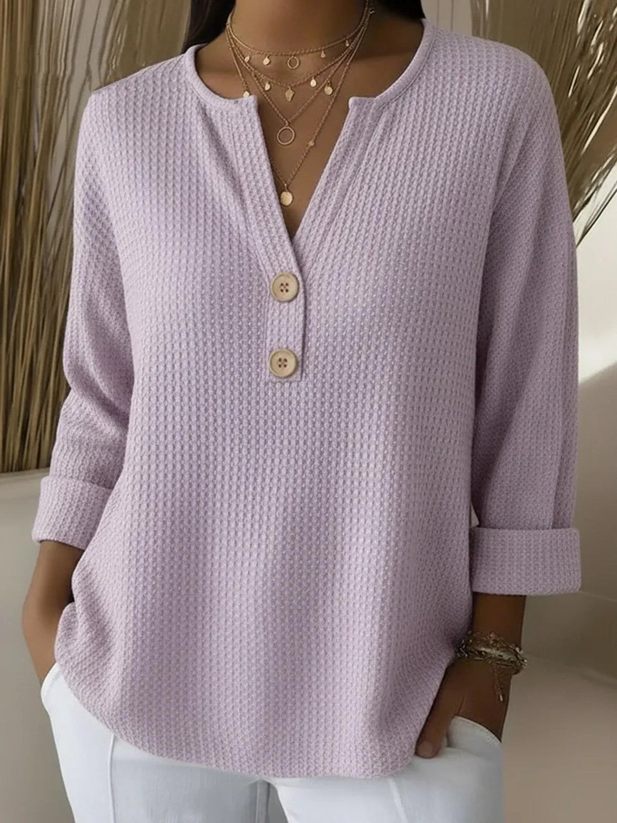 Lucia | Suéter Henley gofrada con botones